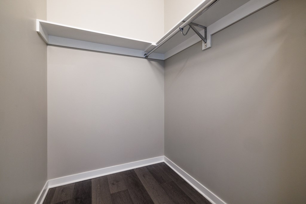 a room with gray walls and a wooden floor