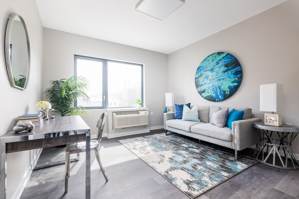 an open living room with a dining room table and couch
