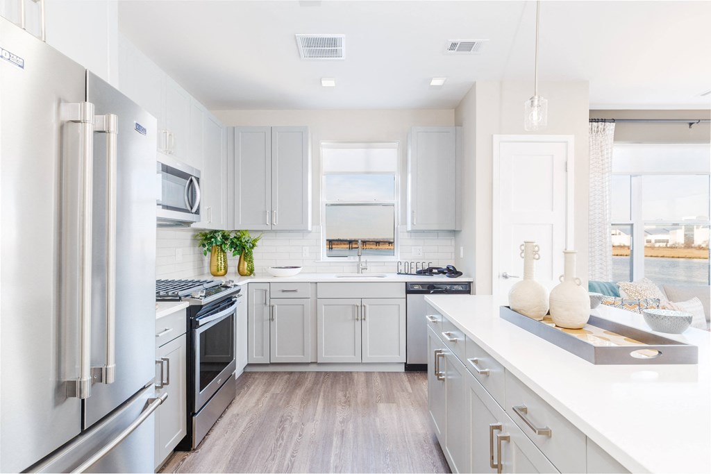 Modern Kitchen Modern Kitchen Including Quartz Countertops, Designer Tile Backsplashes & Stainless Steel Appliances including Gas Range