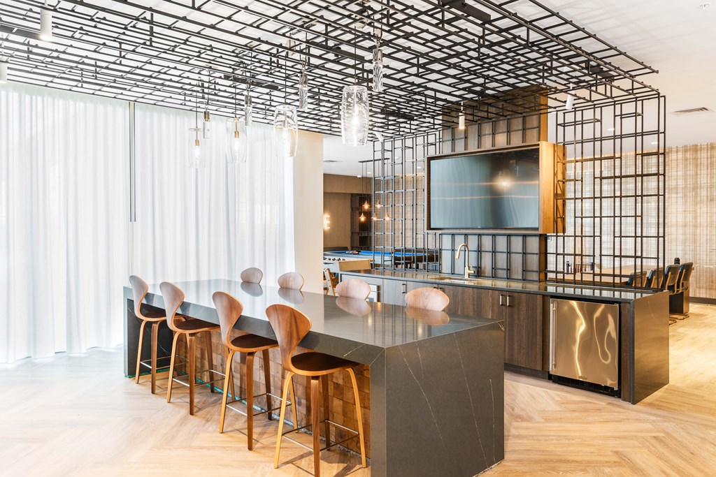 A modern bar with a black and wood theme.