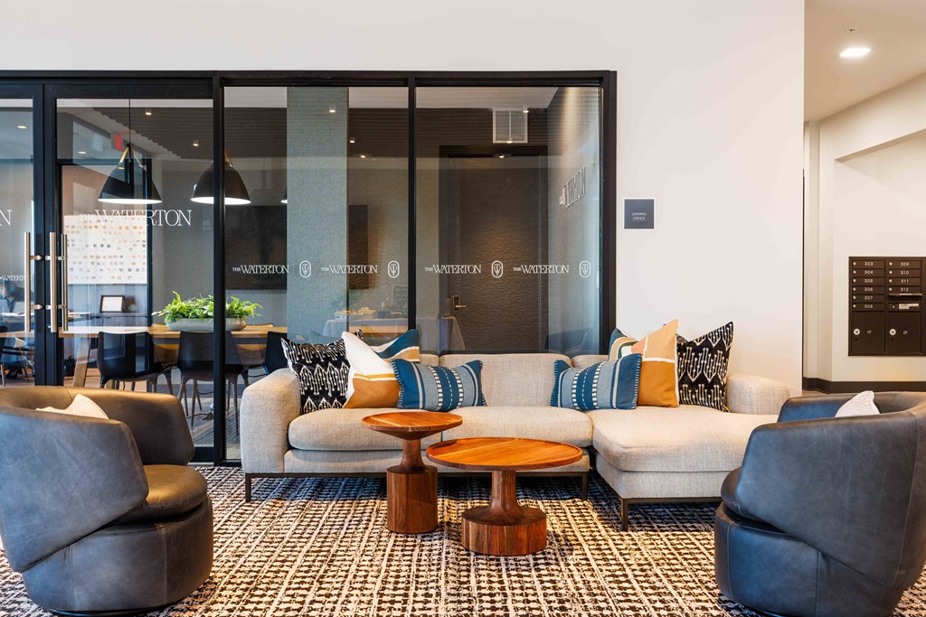 a living room with a couch and tables