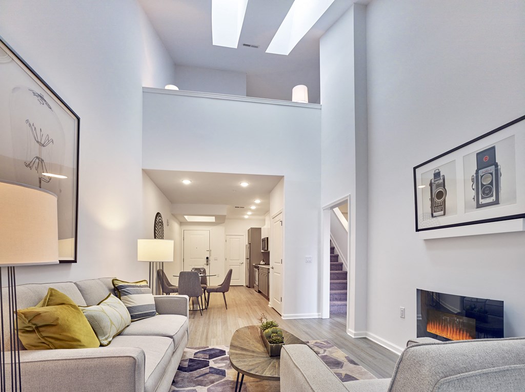 a living room with a couch and a fireplace