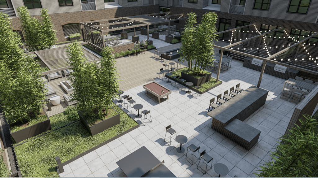 A courtyard with a lot of seating and greenery.