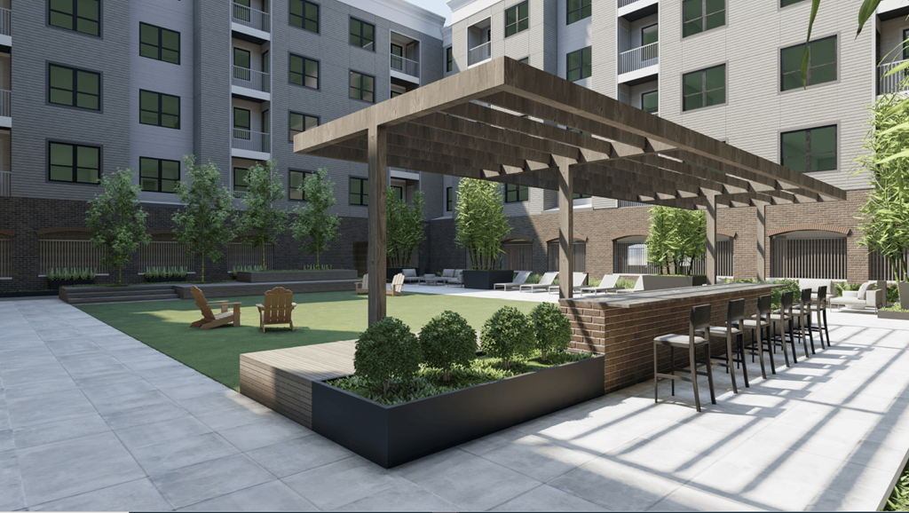 A modern outdoor seating area with a wooden pergola and benches.