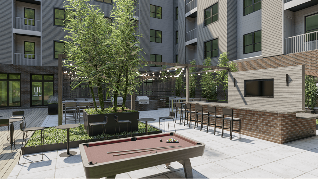A pool table is in the middle of a courtyard with a building in the background.