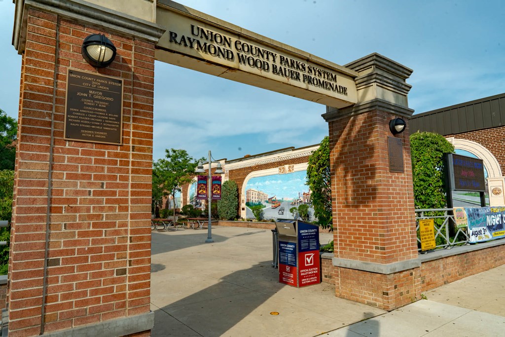 A sign for the Union County Parks System is displayed on a brick archway.