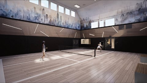 Two people playing tennis in a spacious room with a cityscape mural on the wall.