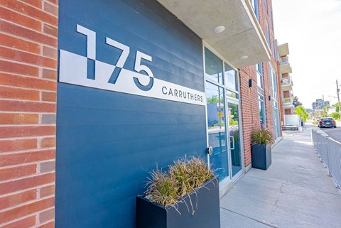 a blue building with a sign on the side of it