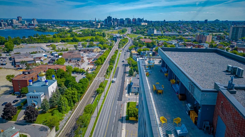 an aerial view of a city with highways and buildings