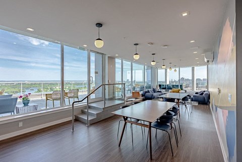 a dining room with a table and chairs