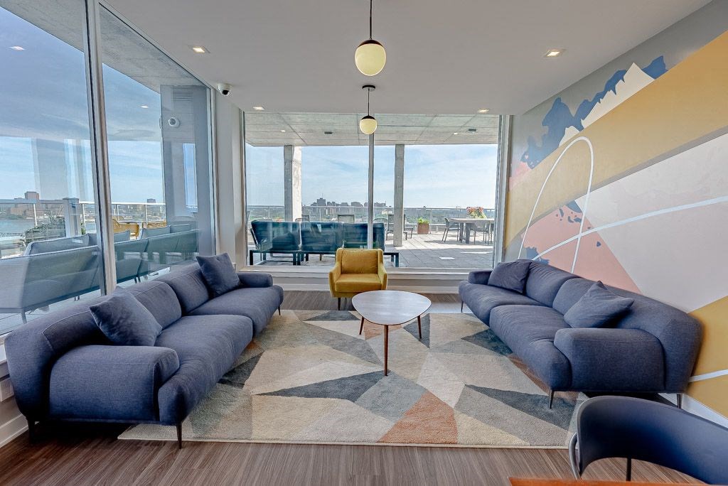 a living room with blue couches and a coffee table