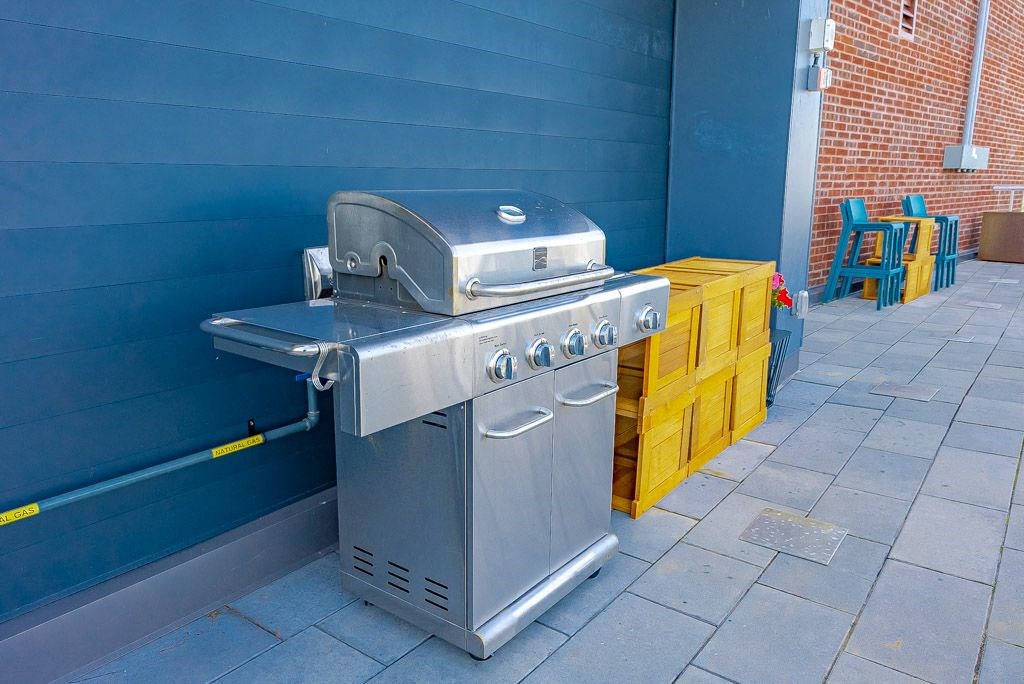 a stainless steel grill on the side of a building