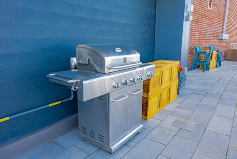 a stainless steel grill on the side of a building