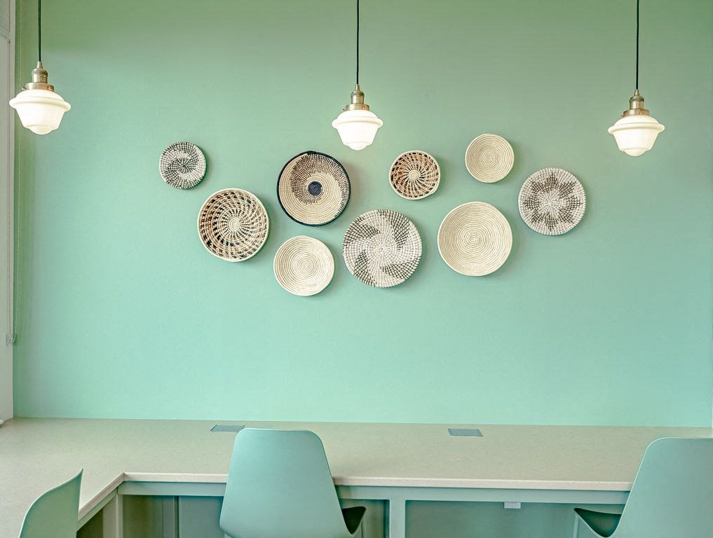 a dining room with plates on the wall