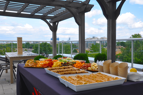 a buffet of food on a table on a roof