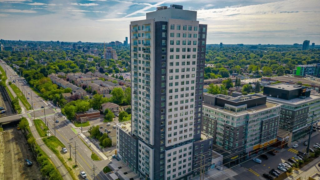 an aerial view of a tall building in a city