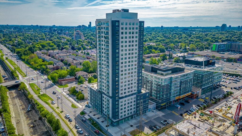 an aerial view of a tall building in a city