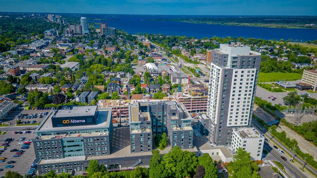 an aerial view of a city with a tall building