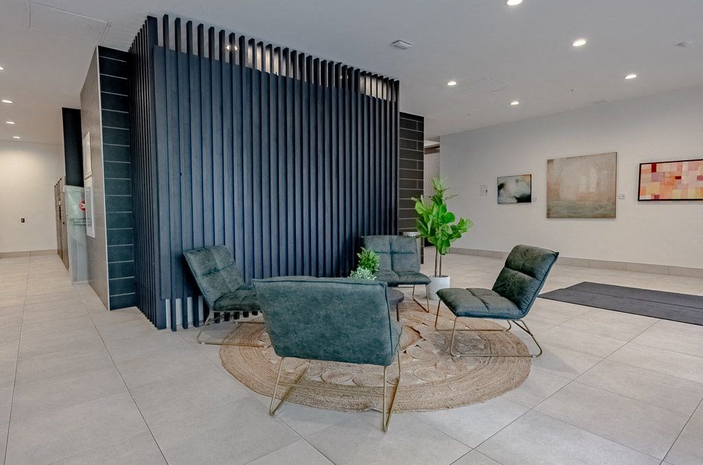 a living room with a table and chairs