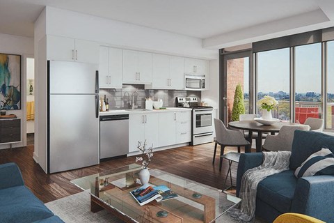 a living room with a kitchen and a table