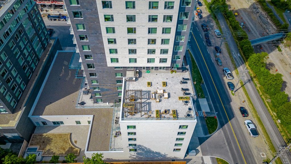 an aerial view of a building with scaffolding on the roof
