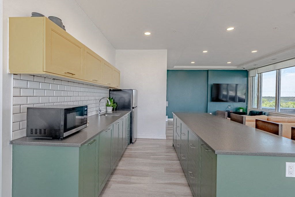 a kitchen with a counter top and a microwave