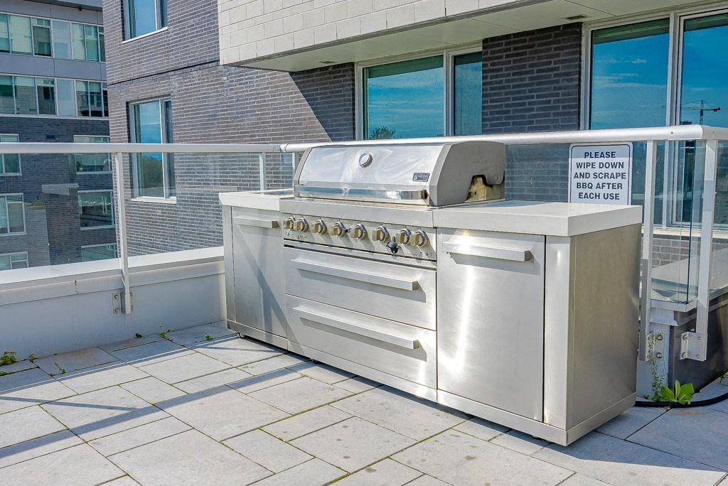 a stainless steel barbecue grill on a patio
