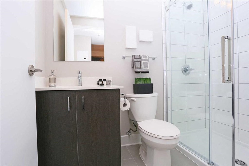 a bathroom with a toilet and a shower