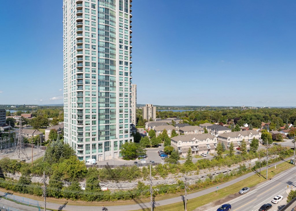 an aerial view of a tall building in a city