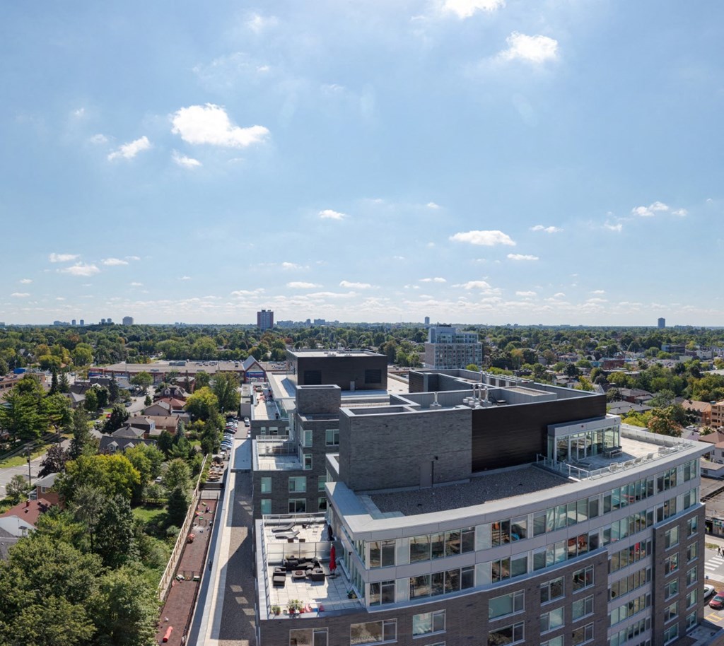 the view of the city from the top of a building