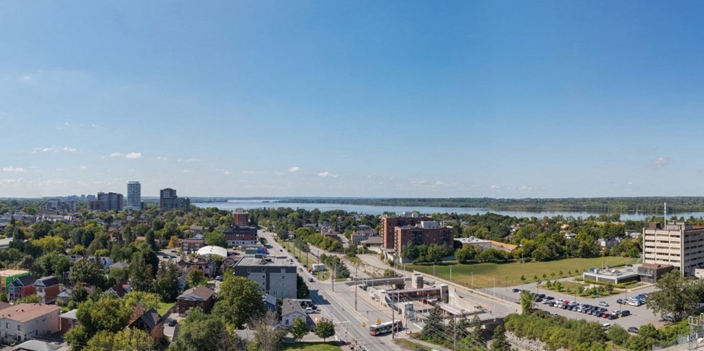 a cityscape of a city with a river in the background