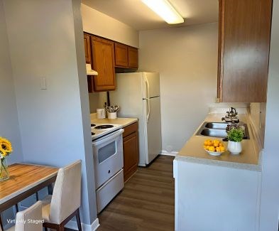 Traditional kitchen with original cabinetry and appliances in a classic 2-bedroom apartment at Lynnhaven Landing in Virginia Beach