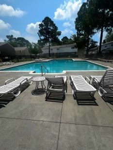 Outdoor community pool at Lynnhaven Landing Apartments in Virginia Beach, offering residents a place to relax and enjoy the sun