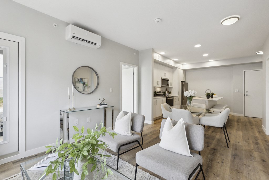 a living room with couches and chairs and a table