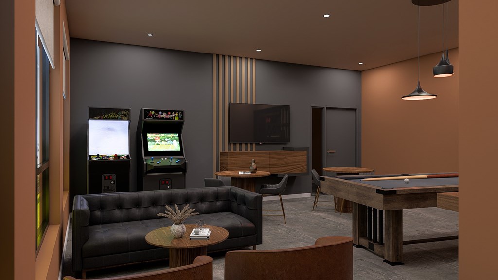 A room with a pool table, a couch, and a television.