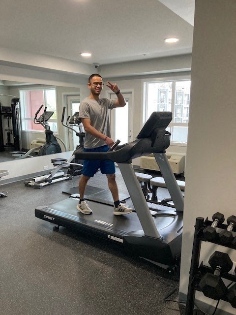 a man is on a treadmill in a gym