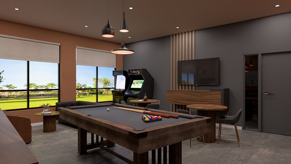 A room with a pool table and a television.