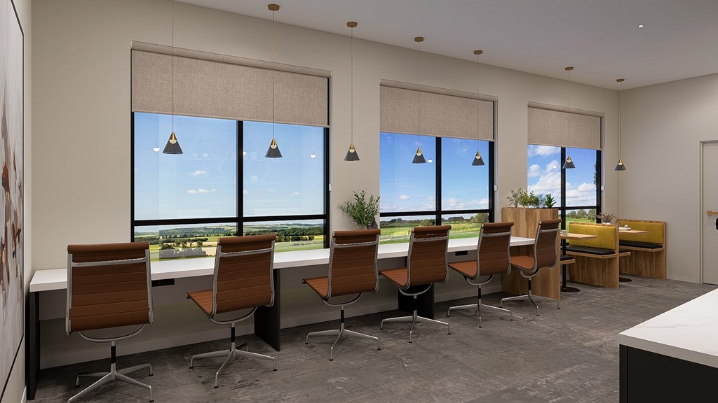 A conference room with a long table and chairs, a whiteboard, and a view of the outdoors through large windows.