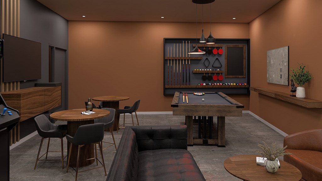 A room with a pool table, a television, and a bar area.