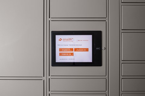 A tablet displaying a Snail mail interface on a grey background.