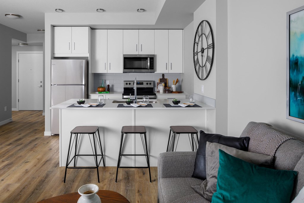 a kitchen and living room in a 555 waverly unit