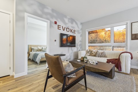 A living room with a brown chair and a coffee table.