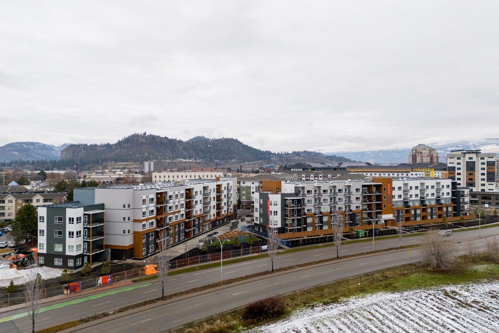 A row of new apartment buildings are under construction.