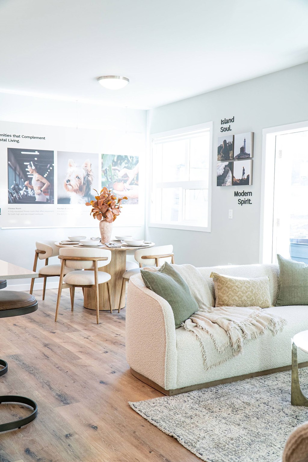 A modern living room with a white couch and a coffee table.