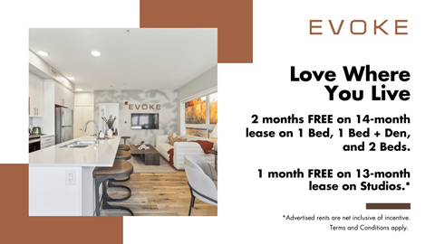 A room with a kitchen and a dining table with chairs and a sign that says EVOKE.