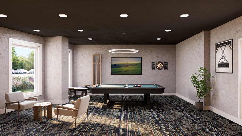 A room with a pool table and a painting on the wall.