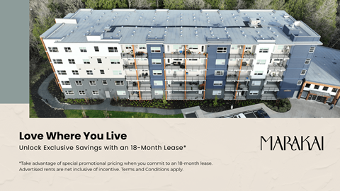 A large building with the words "Love Where You Live" and "Unlock Exclusive Savings with an 18-Month Lease" written on it.