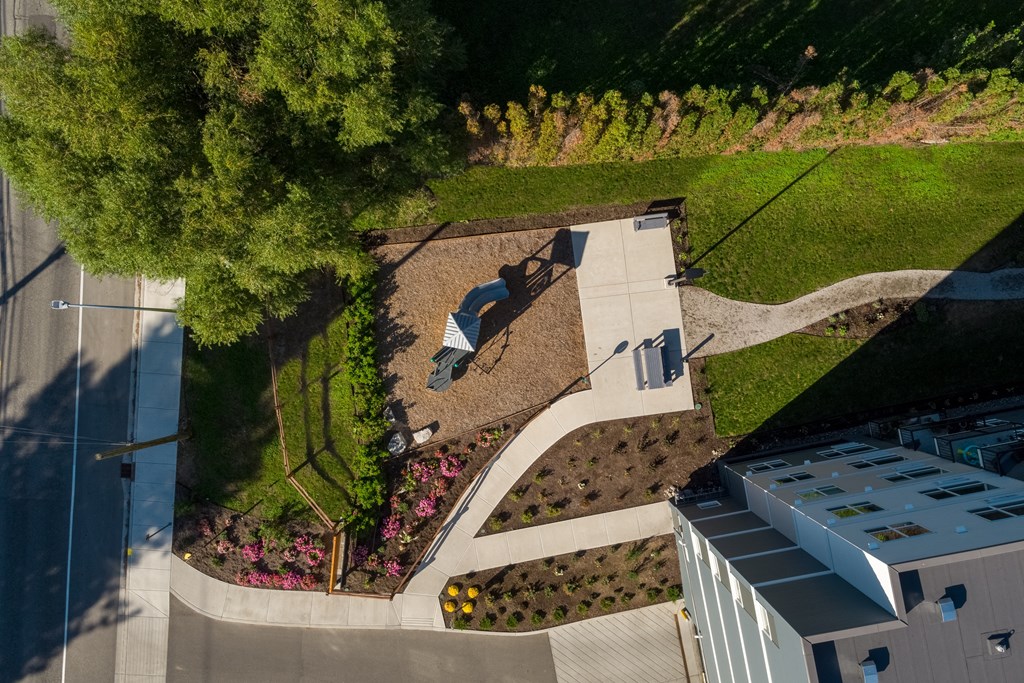 a birdseye view of a garden with a street sign on it