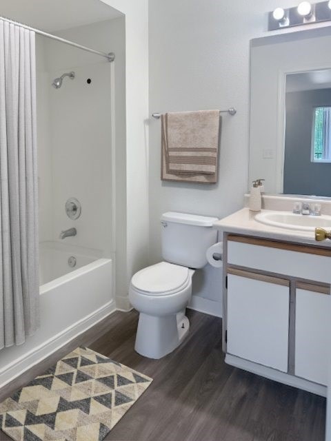 A bathroom with a toilet, sink, and shower at Boulder Creek Apartments, Nevada, 89433