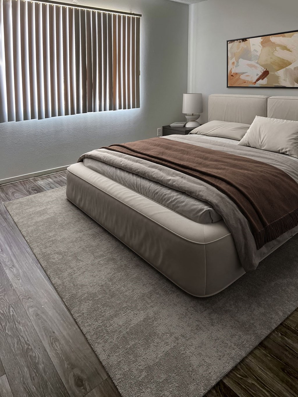 a bedroom with a bed and a rug at Evoq Apartment Homes, Las Vegas  